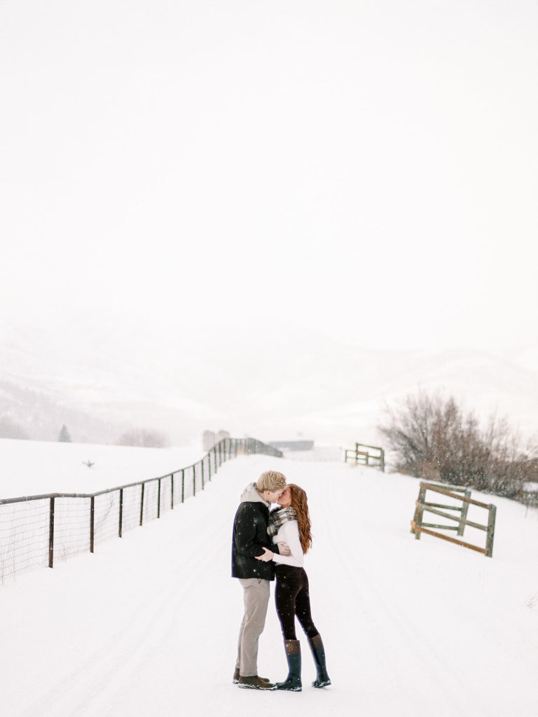 A festive winter Park City couples photoshoot at McPollin Barn Park City by Utah portrait photographer Alora Lani