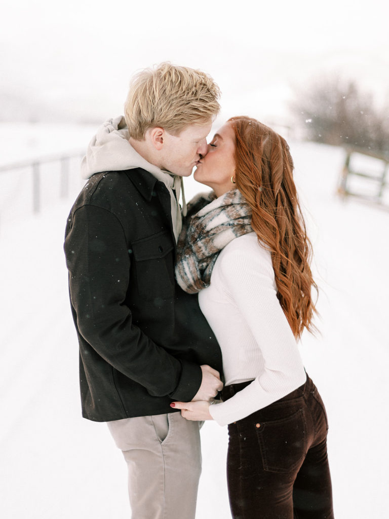 A festive winter Park City couples photoshoot at McPollin Barn Park City by Utah portrait photographer Alora Lani