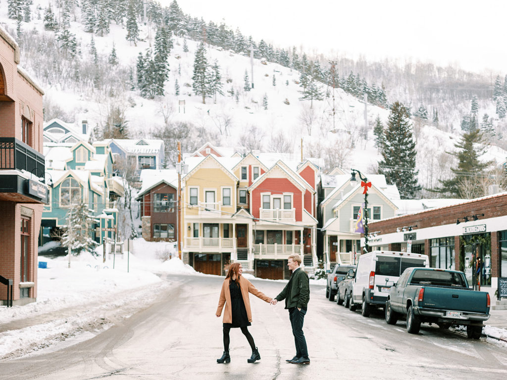 A festive winter Park City couples shoot on main street and McPollin Barn by Utah portrait photographer Alora Lani